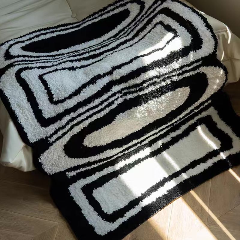 Geometric pattern black and white rug