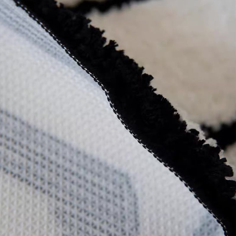 Geometric pattern black and white rug