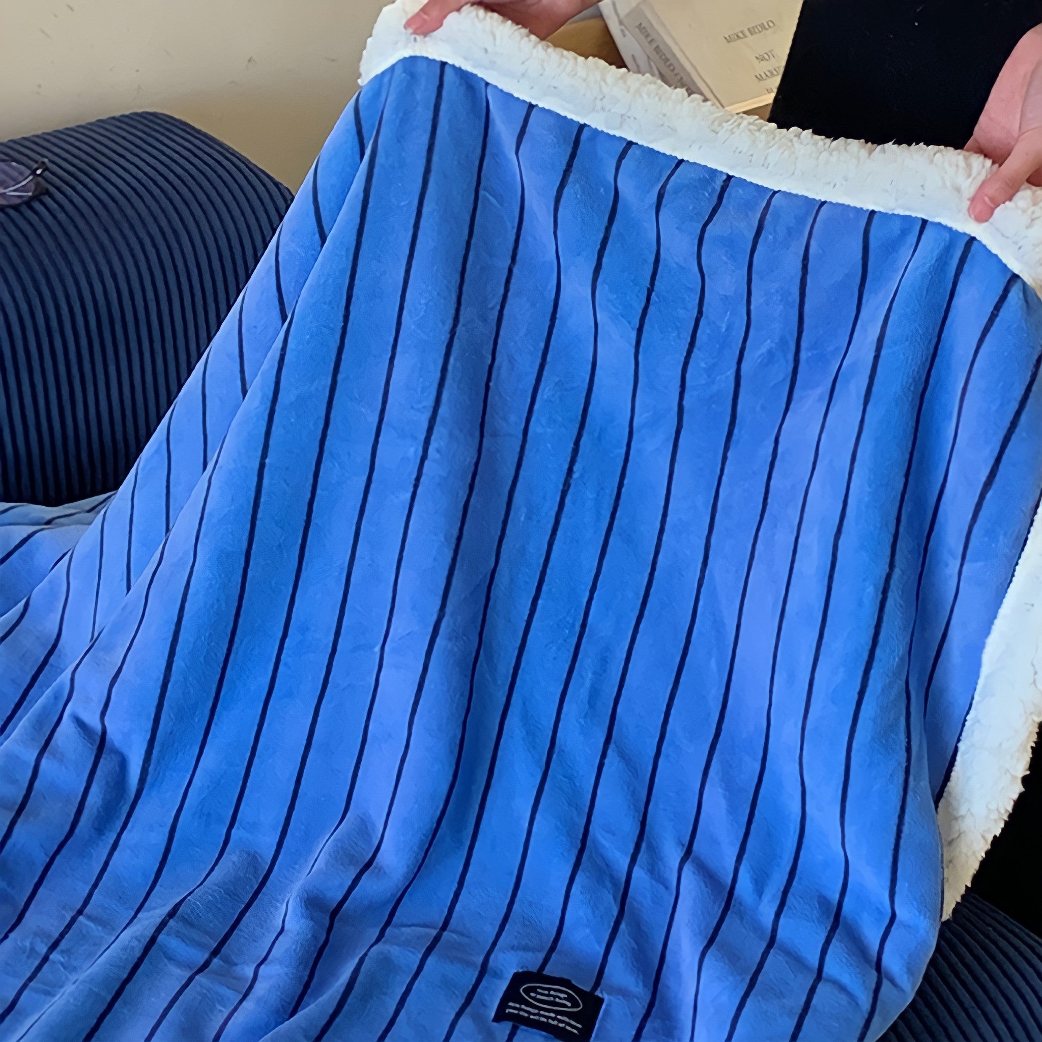Striped fleece blanket in blue
