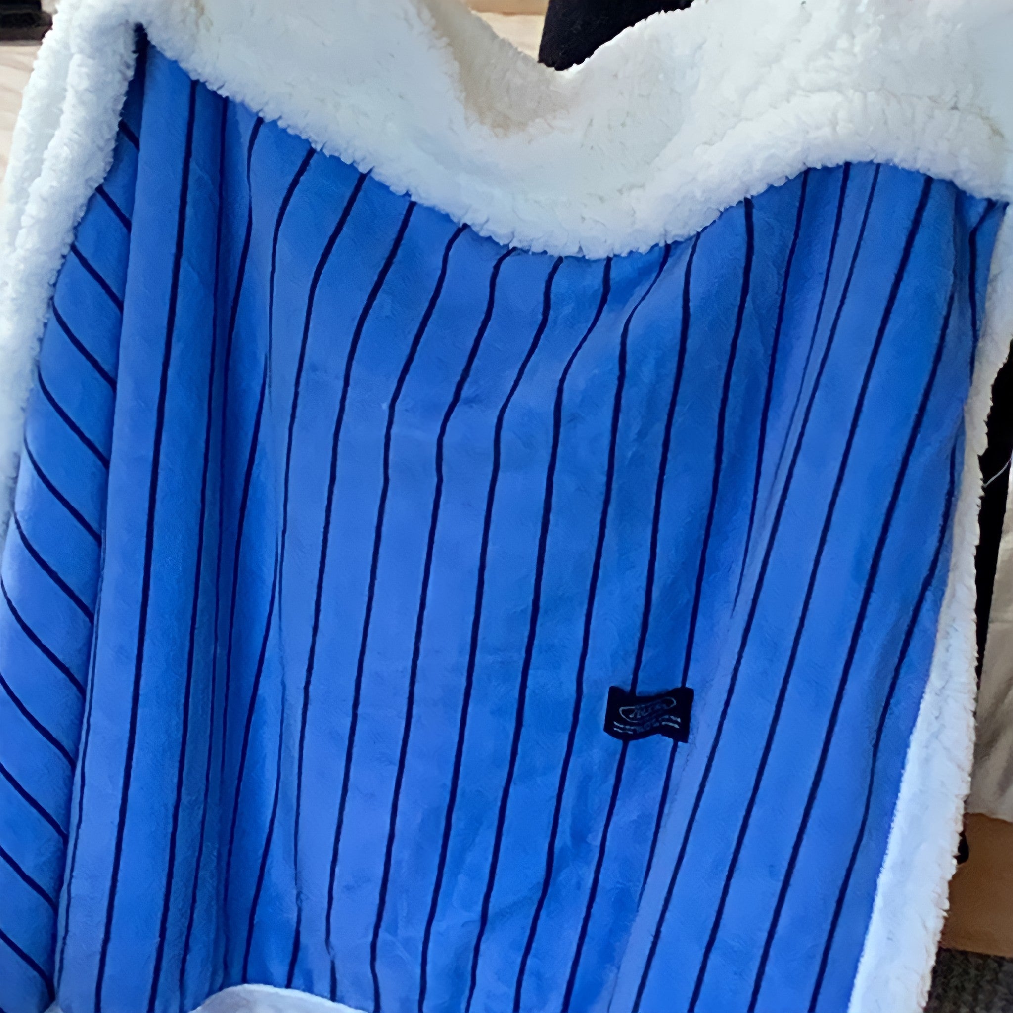 Striped fleece blanket in blue