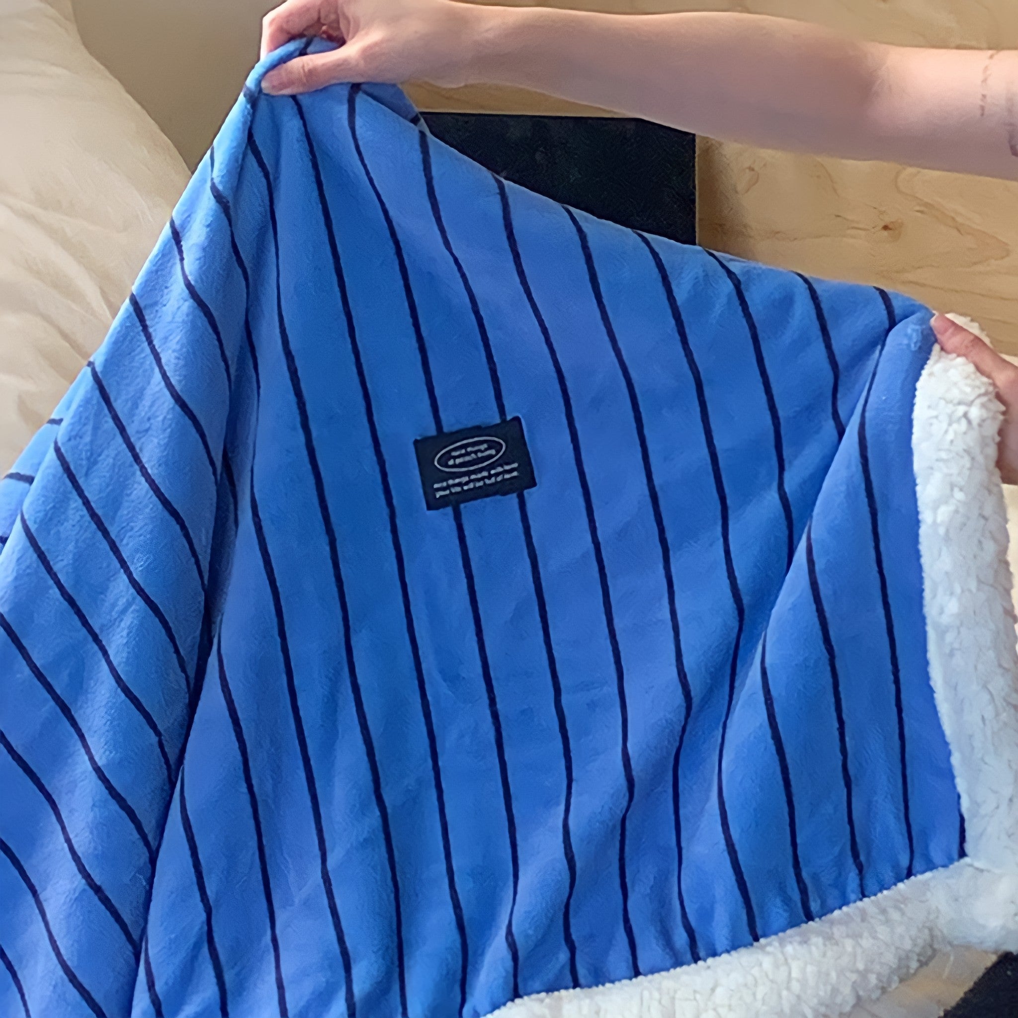 Striped fleece blanket in blue