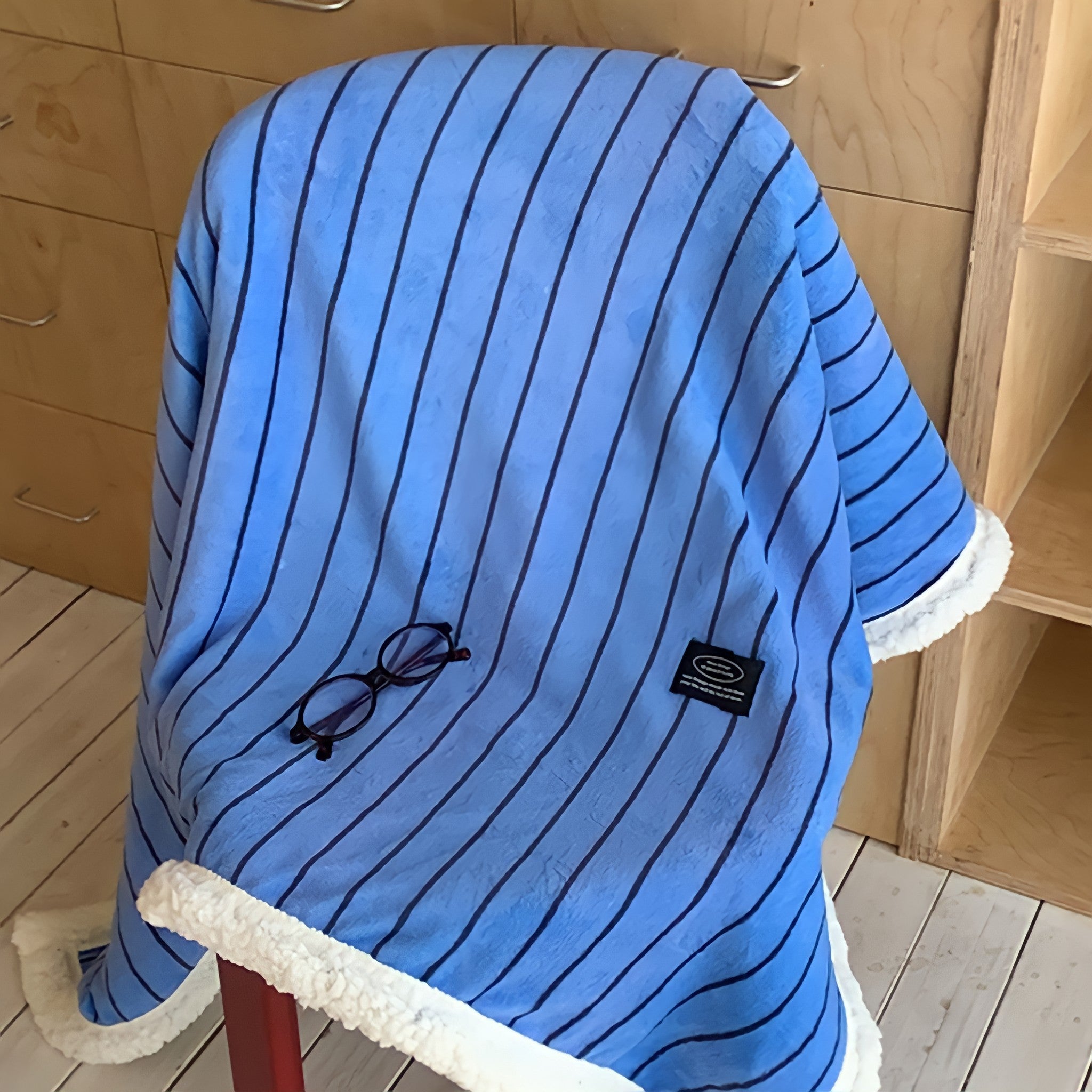 Striped fleece blanket in blue