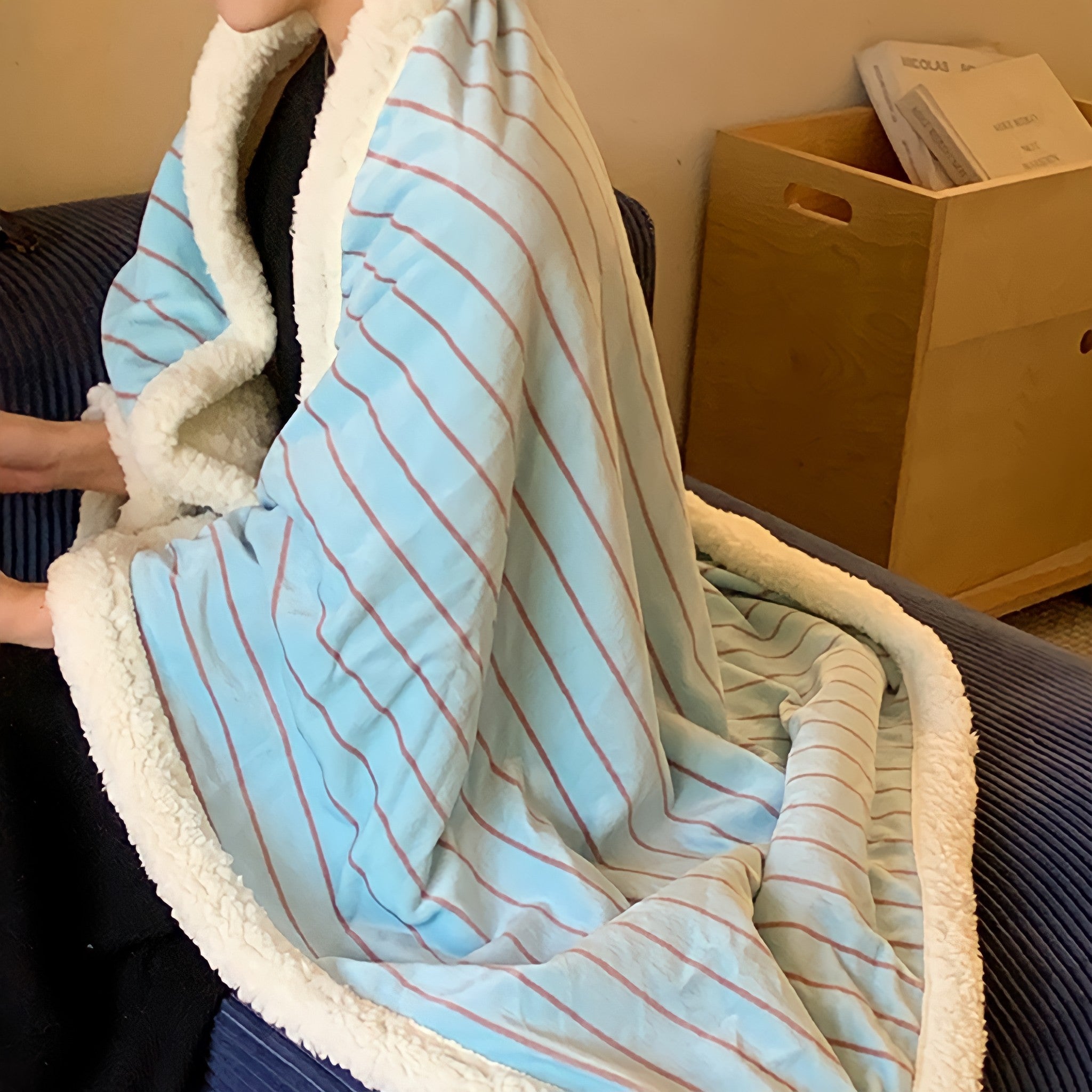 Striped fleece blanket in light blue