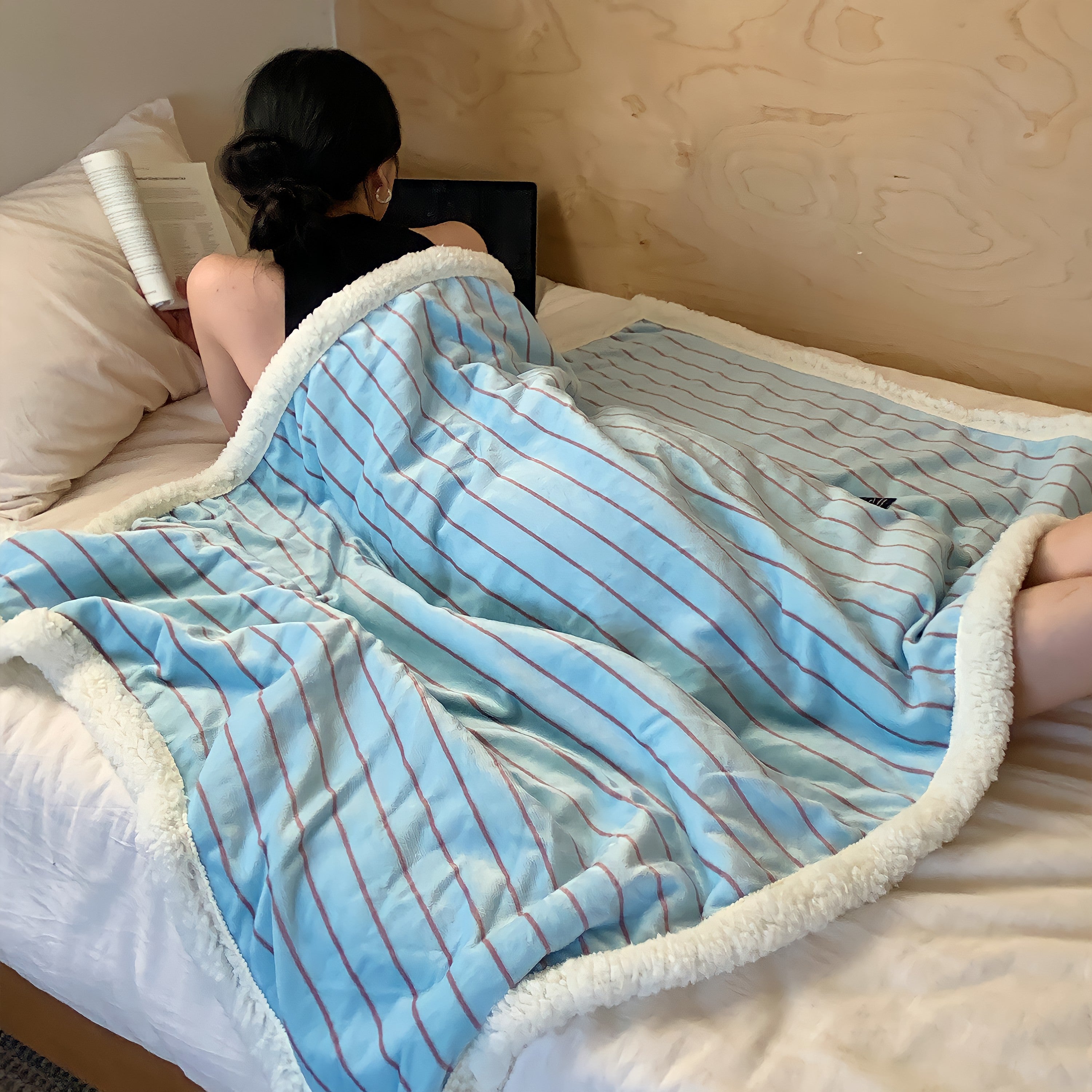 Striped fleece blanket in light blue