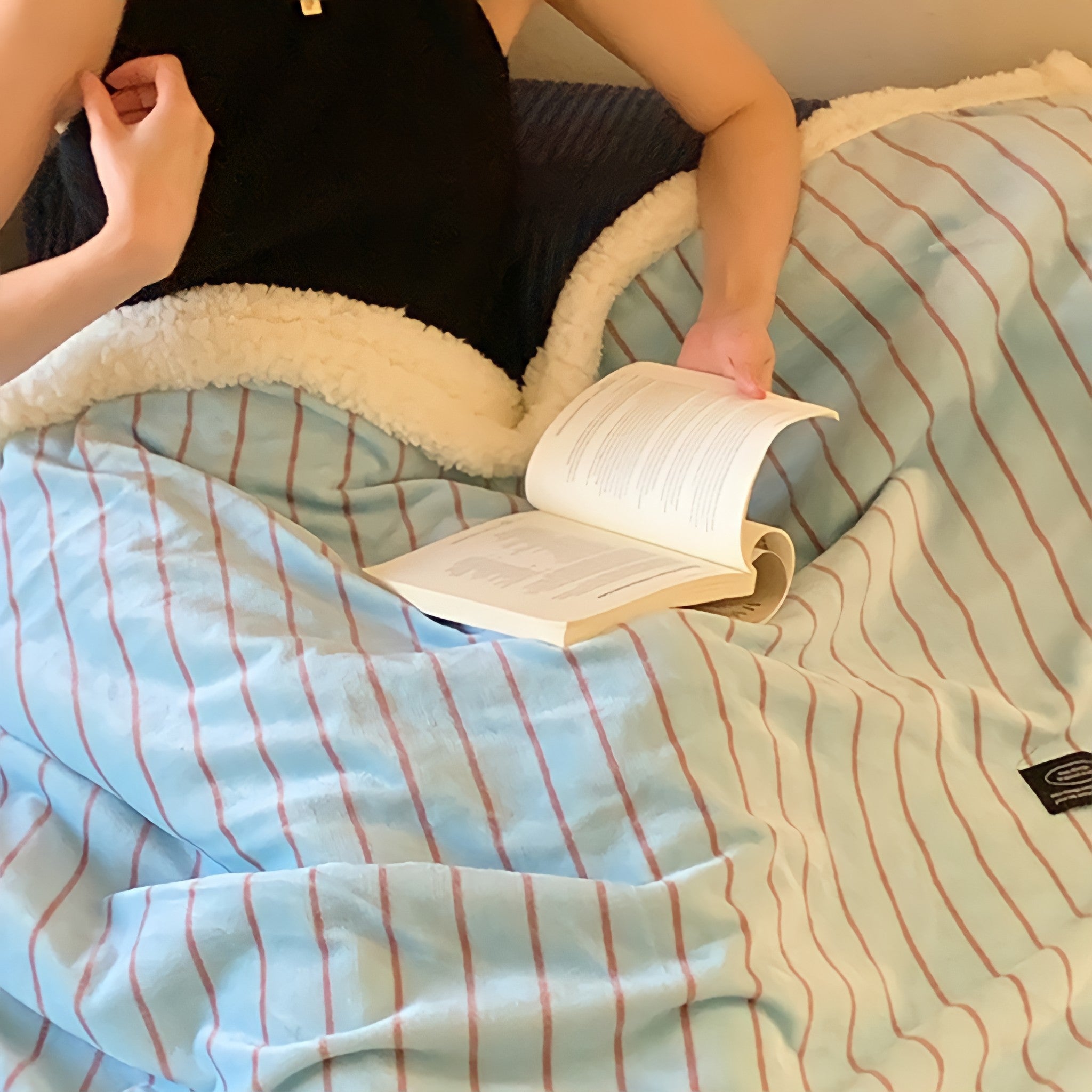 Striped fleece blanket in light blue