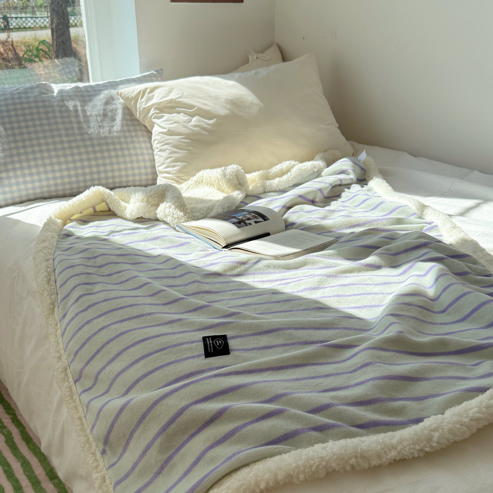 Striped fleece blanket in light green