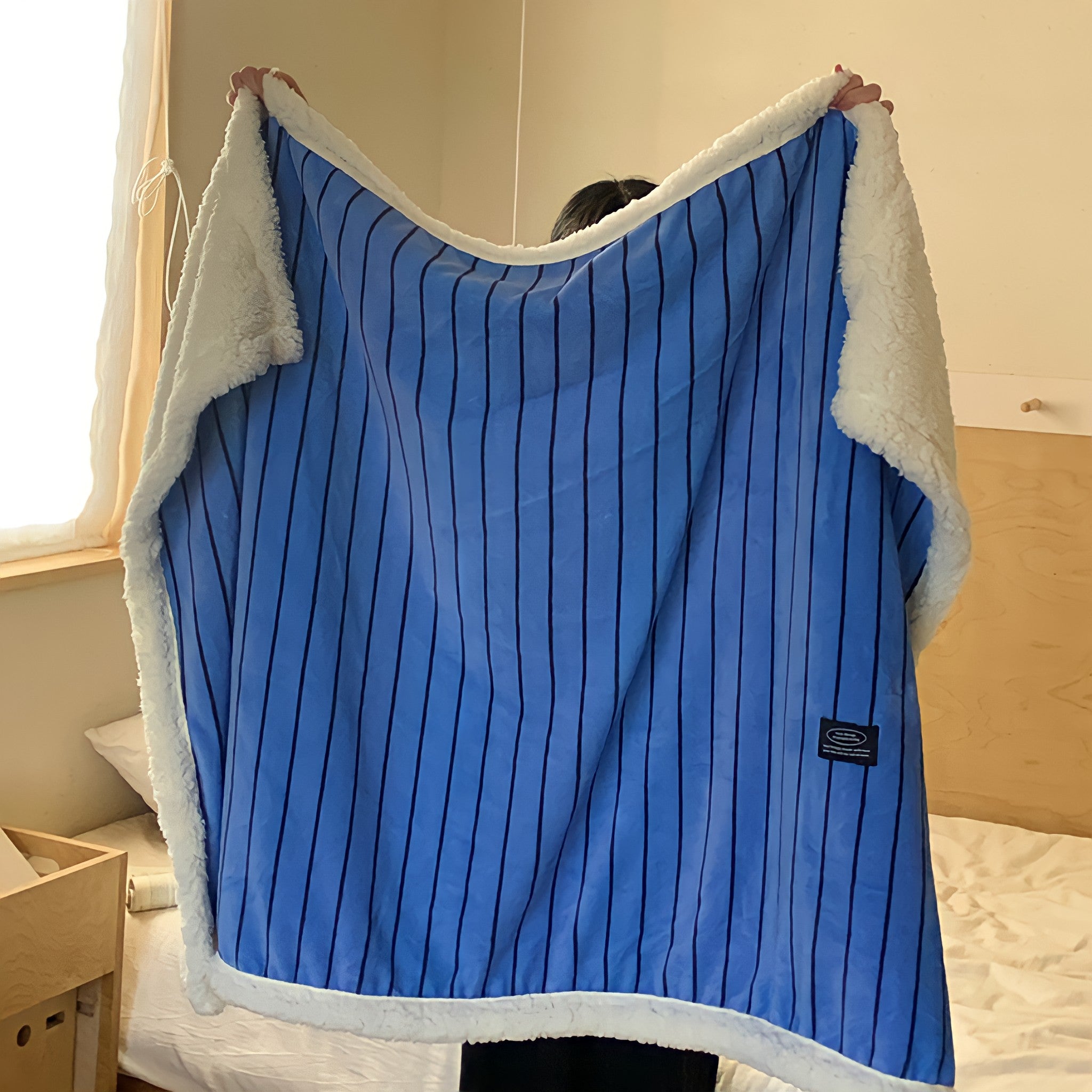 Striped fleece blanket in blue